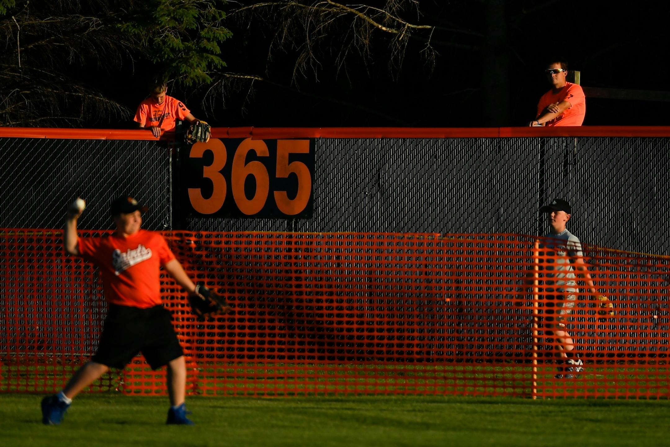 Children fielded balls during Friday night's home run derby between the County Line League and the Stearns County League on June 30, 2017 in Elrosa, Minn.