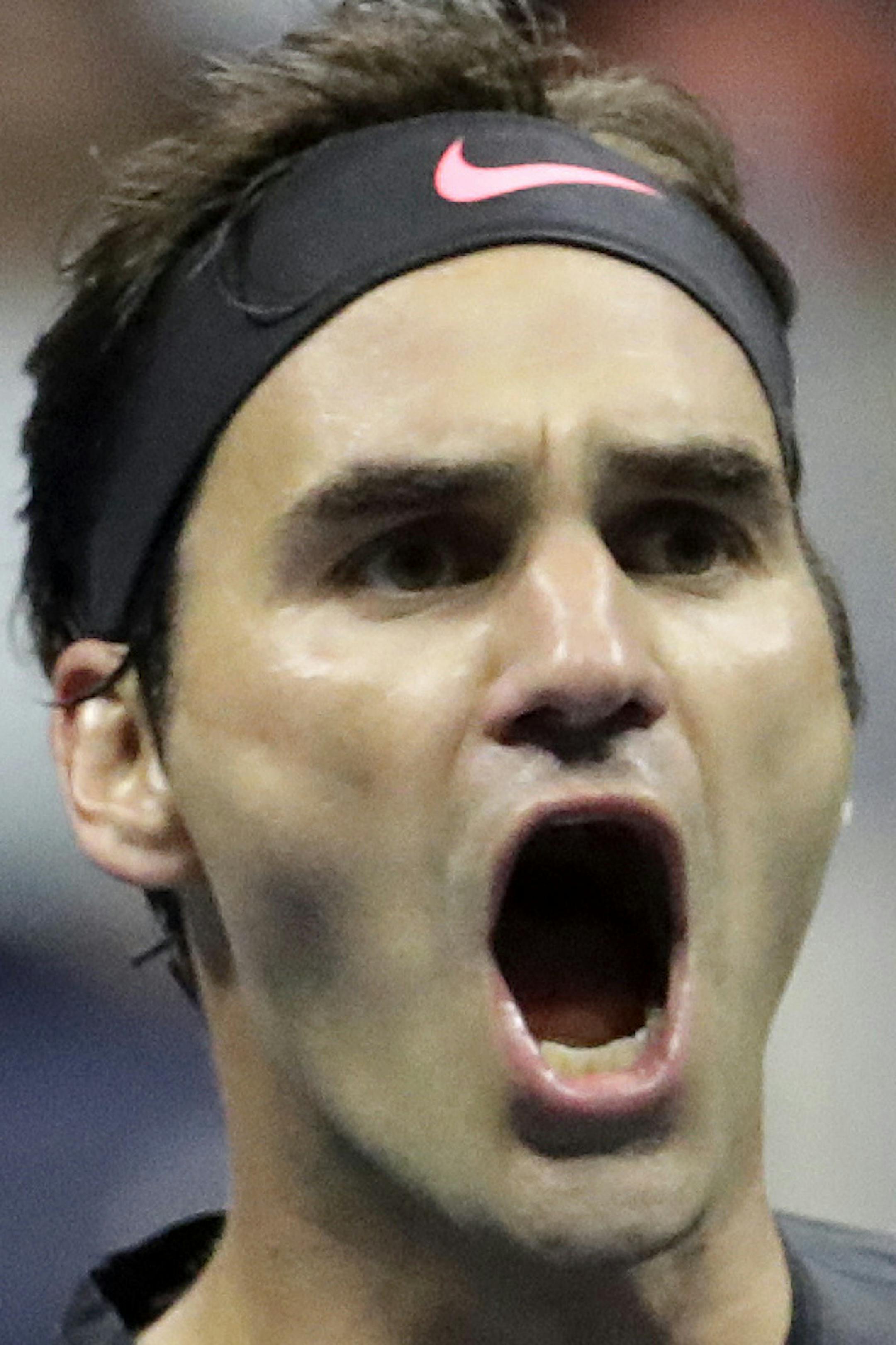 Roger Federer, of Switzerland, reacts after winning a game against Frances Tiafoe, of the United States, during the U.S. Open tennis tournament, Tuesday, Aug. 29, 2017, in New York. (AP Photo/Julio Cortez)