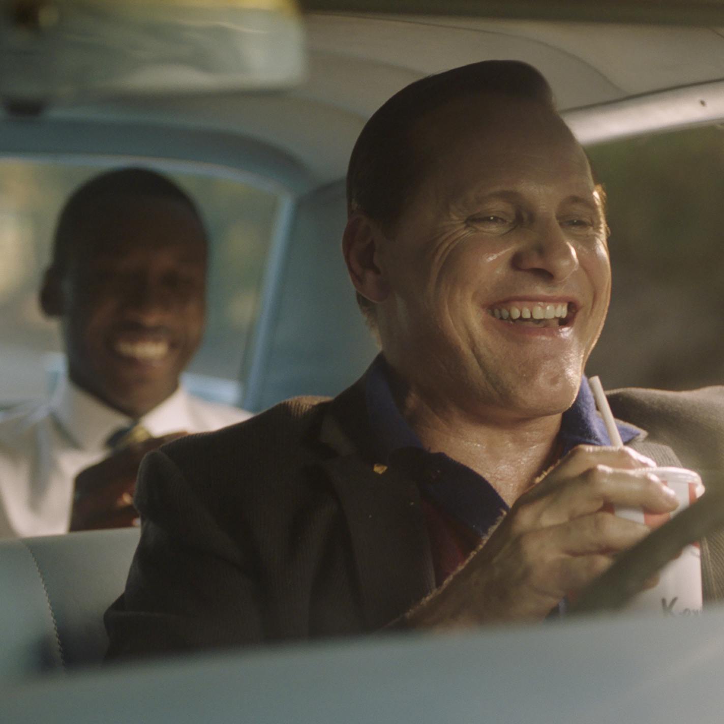 This image released by Universal Pictures shows Viggo Mortensen, foreground, and Mahershala Ali in a scene from "Green Book." (Universal Pictures via AP)