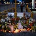 Flower and a pictures are left as a tribute to Russian opposition leader Alexei Navalny, near to the Russian Embassy in Budapest, Hungary, Saturday, F