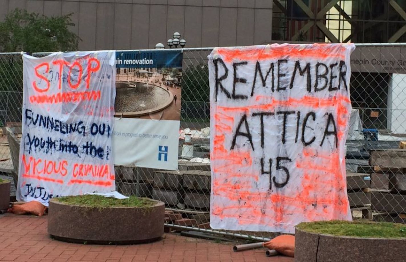 Signs posted near the Hennepin County Government Center as part of Friday's protests.