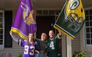 Standing in front of their Eden Prairie home, Jenn, Olivia and Paul Russo, left to right, are among Minnesota’s divided families this football seaso