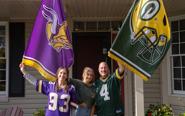 Standing in front of their Eden Prairie home, Jenn, Olivia and Paul Russo, left to right, are among Minnesota’s divided families this football seaso