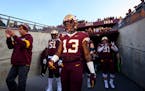 Gophers players got ready to take the field before Saturday's game.