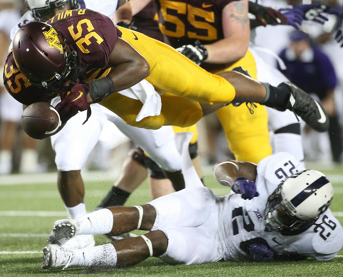 Gophers running back Rodrick Williams Jr. lost the ball as he was being defended by TCU's safety Derrick Kindred in the second quarter as the Gophers took on TCU at TCF Stadium, Thursday, September 3, 2015 in Minneapolis, MN. ] (ELIZABETH FLORES/STAR TRIBUNE) ELIZABETH FLORES &#x2022; eflores@startribune.com