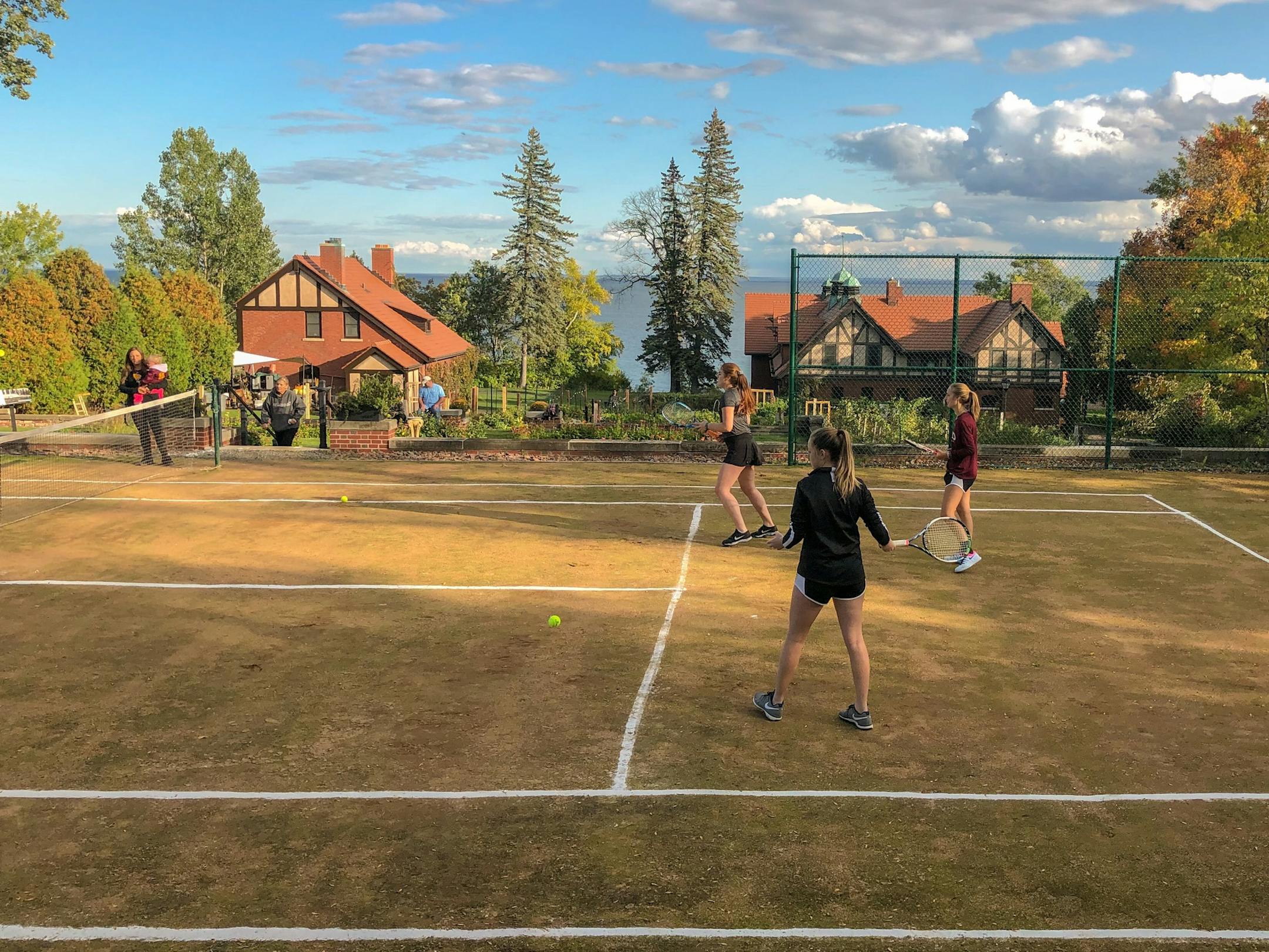 The UMD women's tennis team held practice on the historic natural clay court above Lake Superior at the Glensheen mansion in Duluth on Wednesday.