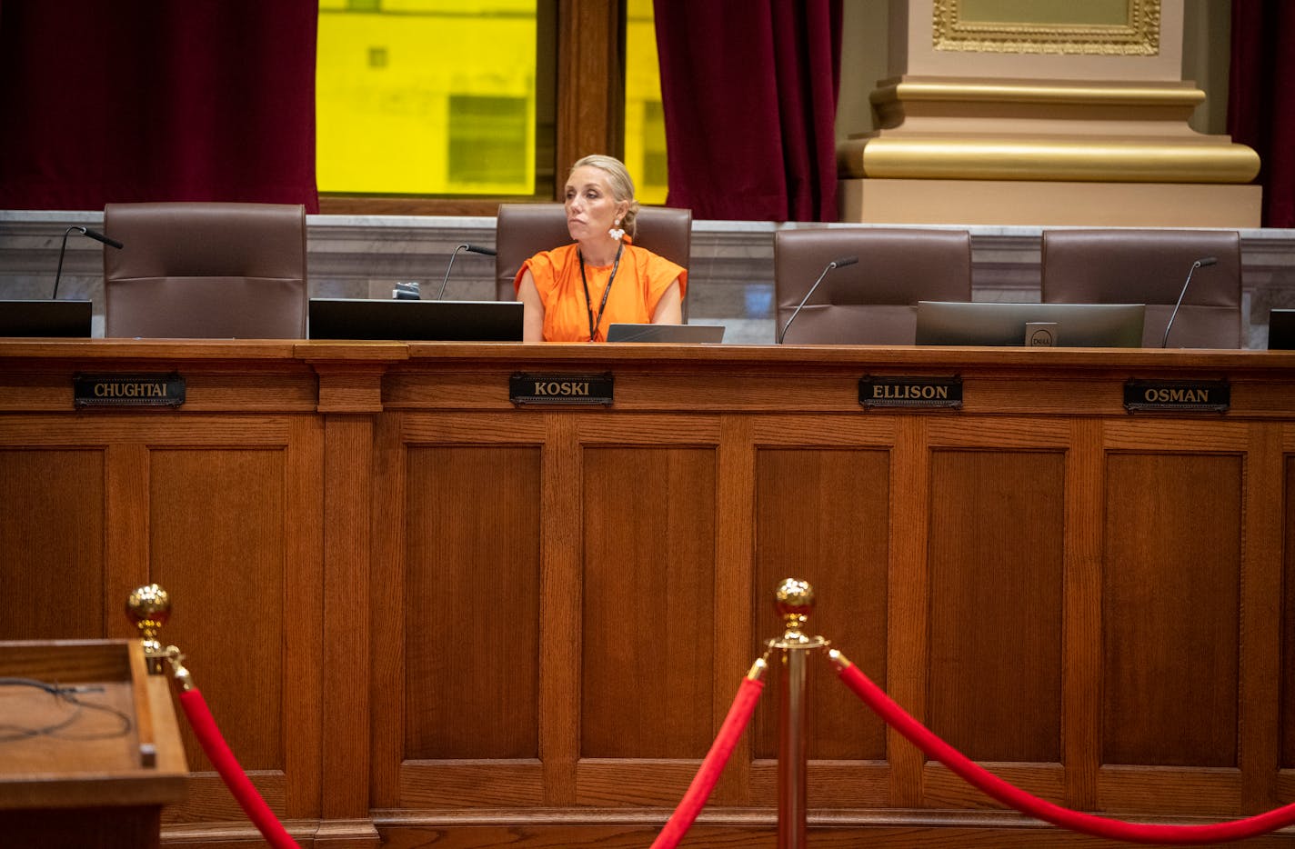 City council member Emily Koski is surrounded by the empty seats of city council members Aisha Chughtai, from left, Jeremiah Ellison, and Jamal Osman, who are away observing Eid, during the Minneapolis City Council meeting on Wednesday, June 28, 2023 in Minneapolis, Minn. Because those three members were absent, the rent stabilization ballot measure did not have enough votes to be advanced to committee.