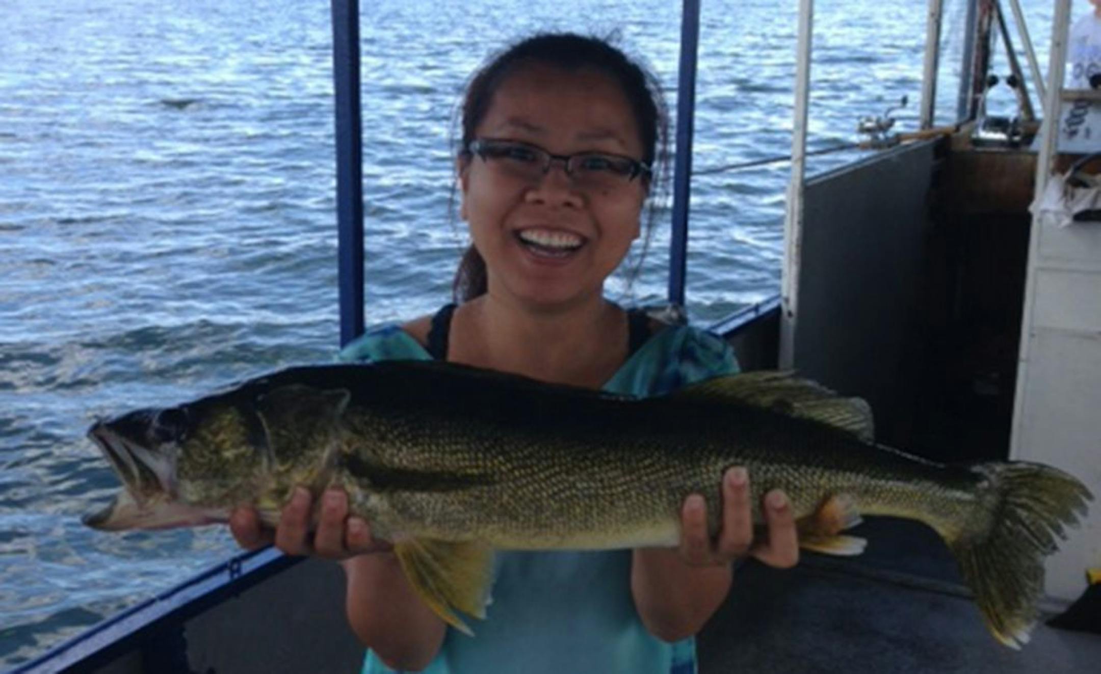 BEGINNER'S LUCK Monica Chit of Shakopee caught this dandy 28-inch walleye during her first-ever outing at Lake Mille Lacs. She used a leech and bobber, and released the fish.