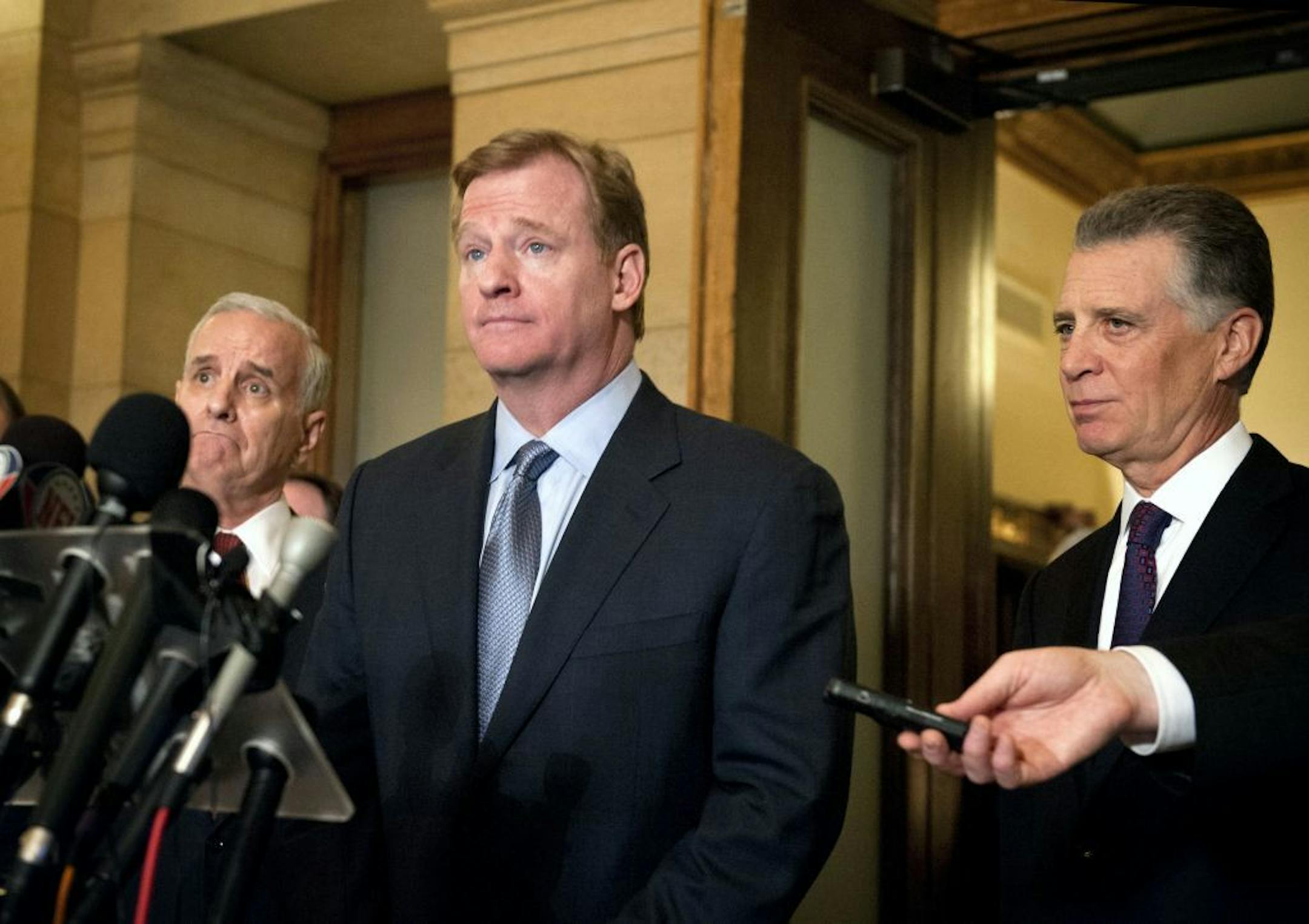 NFL commissioner Roger Goodell was flanked by Governor Mark Dayton, left and Art Rooney II, right, owner of the Pittsburgh Steelers and the head of the league's stadium committee as he spoke to the media after they met at the Capitol to discuss the Vikings stadium.