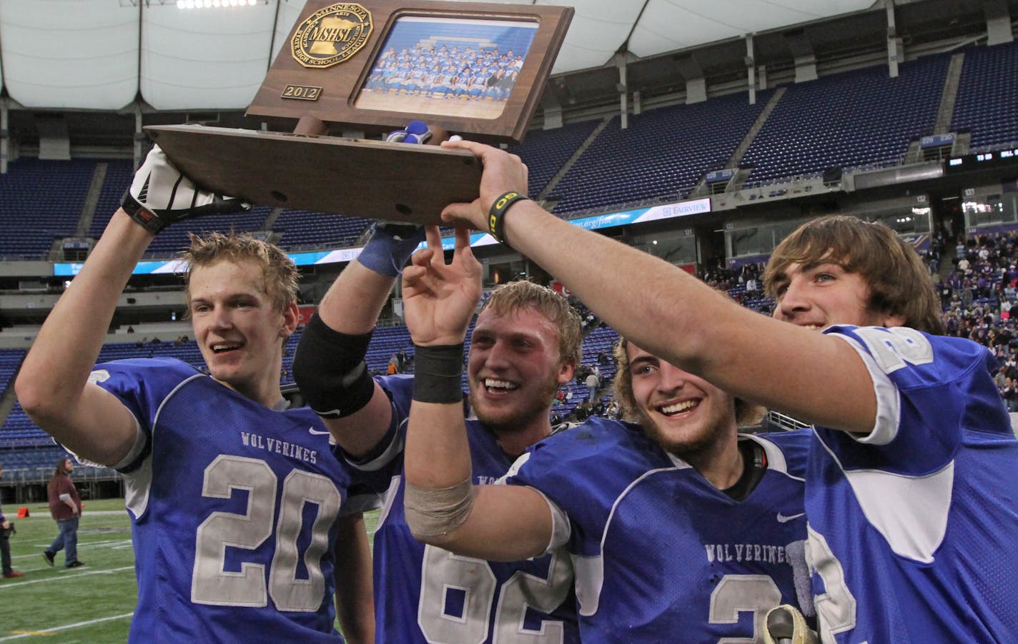 Minnesota Prep Bowl Finals, 9-Man, Grand Meadow vs. Clinton-Graceville-Beardsley 11/23/12, played at the Metrodome. (left to right) CGB players celebrated their championship win over Grand Meadow.] Bruce Bisping/Star Tribune bbisping@startribune.com