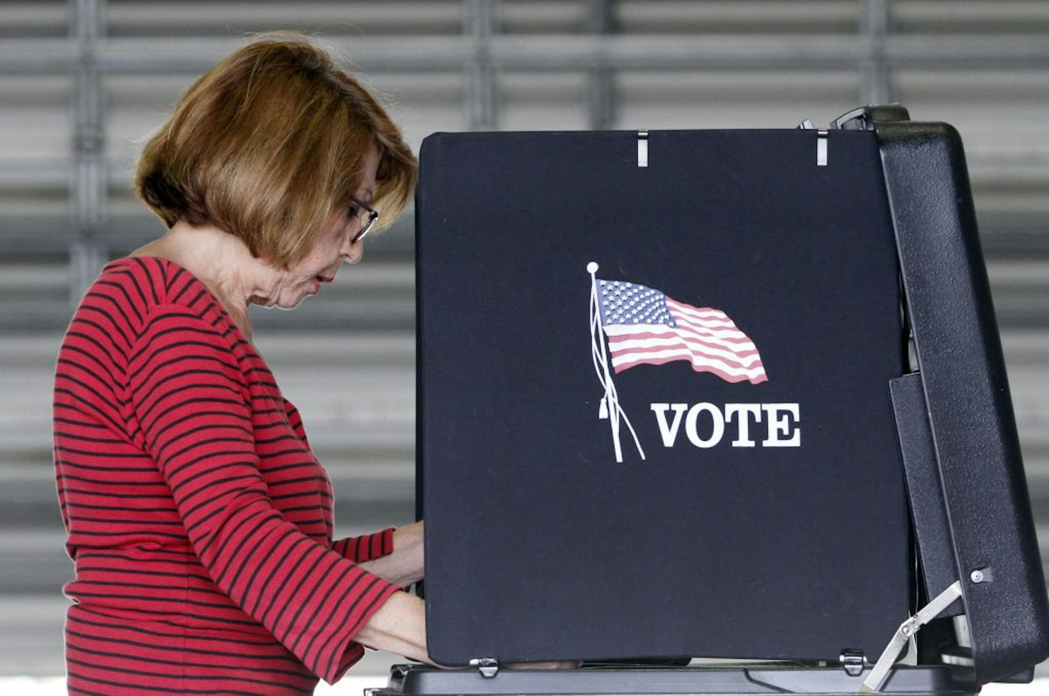 Lida Bonilla casts her vote during the Florida Primary elections in Hialeah, Fla., Tuesday, Aug. 14, 2012.