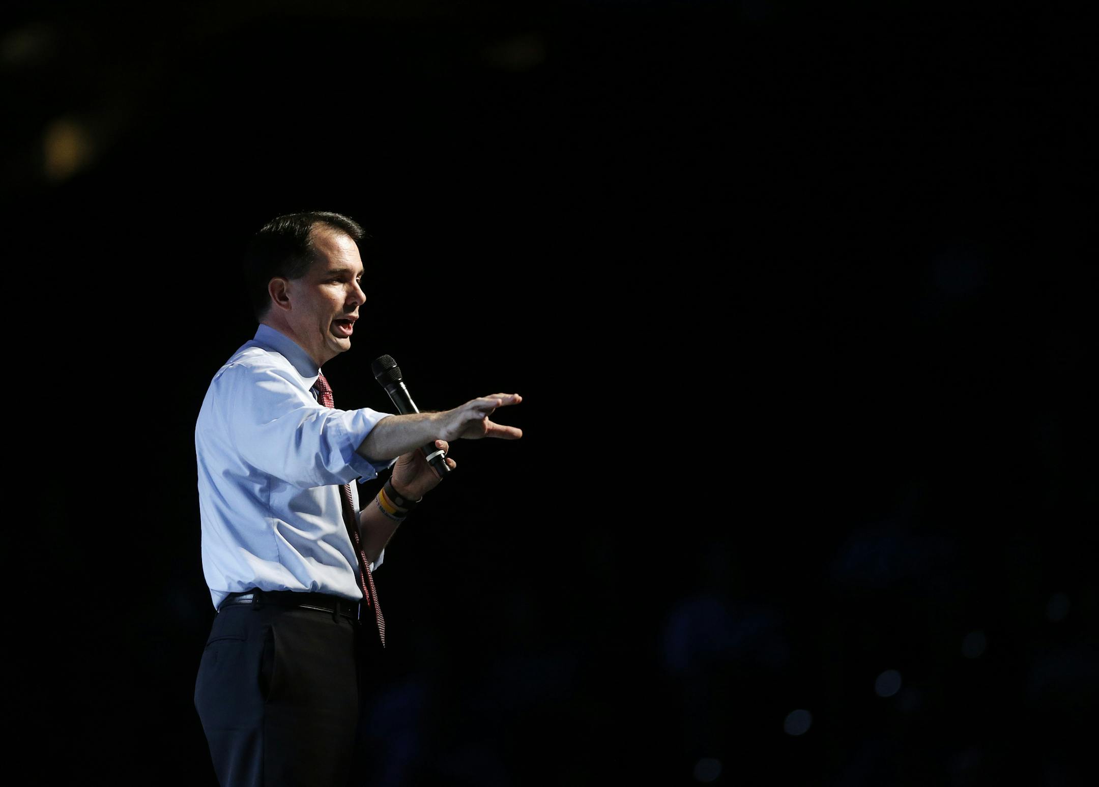 FILE- In this June 27, 2015, file photo, Republican Wisconsin Gov. Scott Walker speaks at the Western Conservative Summit, hosted by the Centennial Institute, Colorado Christian University's think tank, in Denver. Walker, who is to enter the 2016 Republican presidential contest on Monday, July 13, has a national profile largely due to his clashes with labor unions. (AP Photo/Brennan Linsley, File)