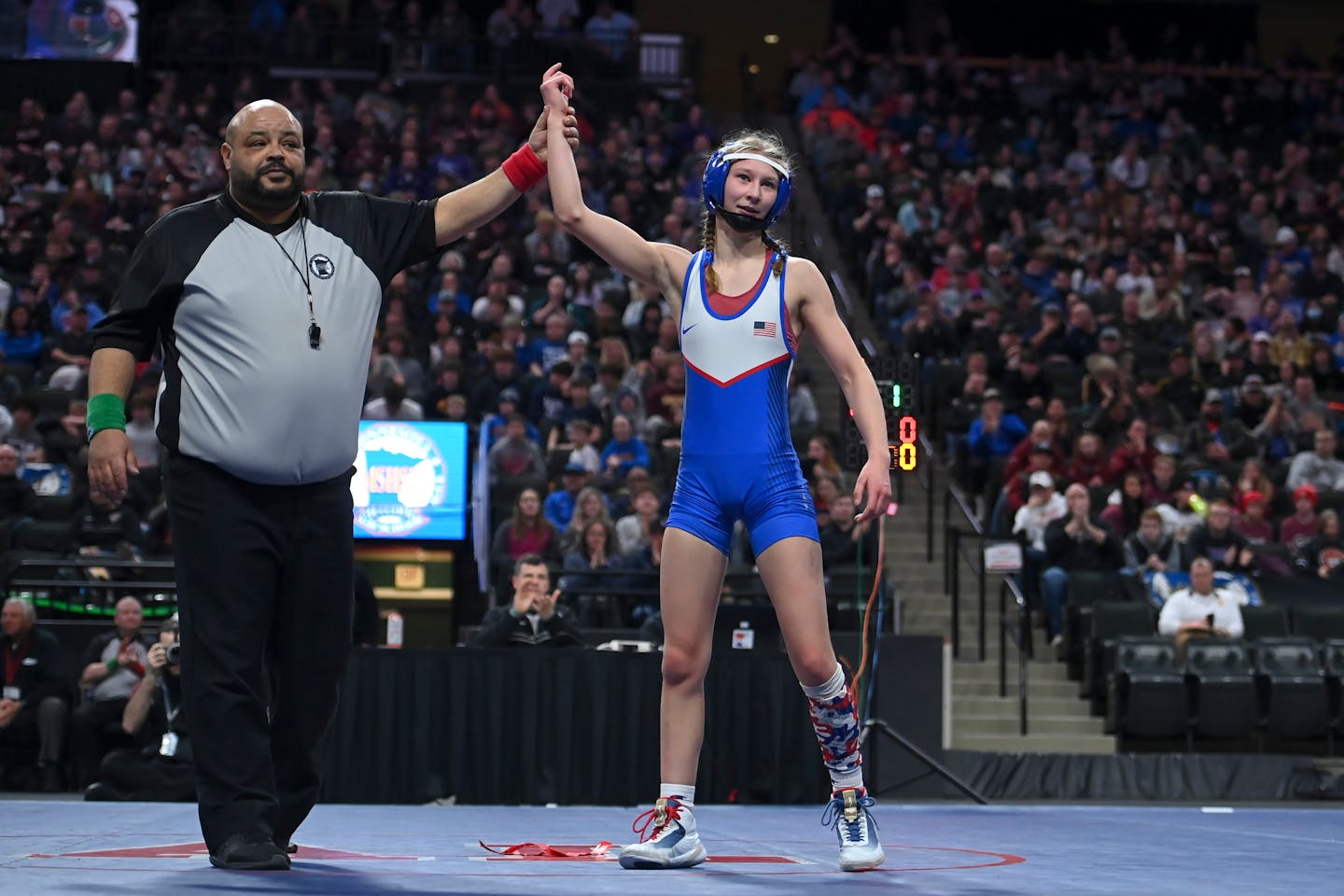 Simley's Charli Raymond is named champions after wrestling Pine Island's Lauren Elsmore in the 100lb final match during the Minnesota State High School girls Wrestling Championships Saturday, March 5, 2022 at Xcel Energy Center in St. Paul, Minn. Raymond won by decision 10-0, becoming the first-ever high school girls wrestling champion in Minnesota. ] AARON LAVINSKY • aaron.lavinsky@startribune.com