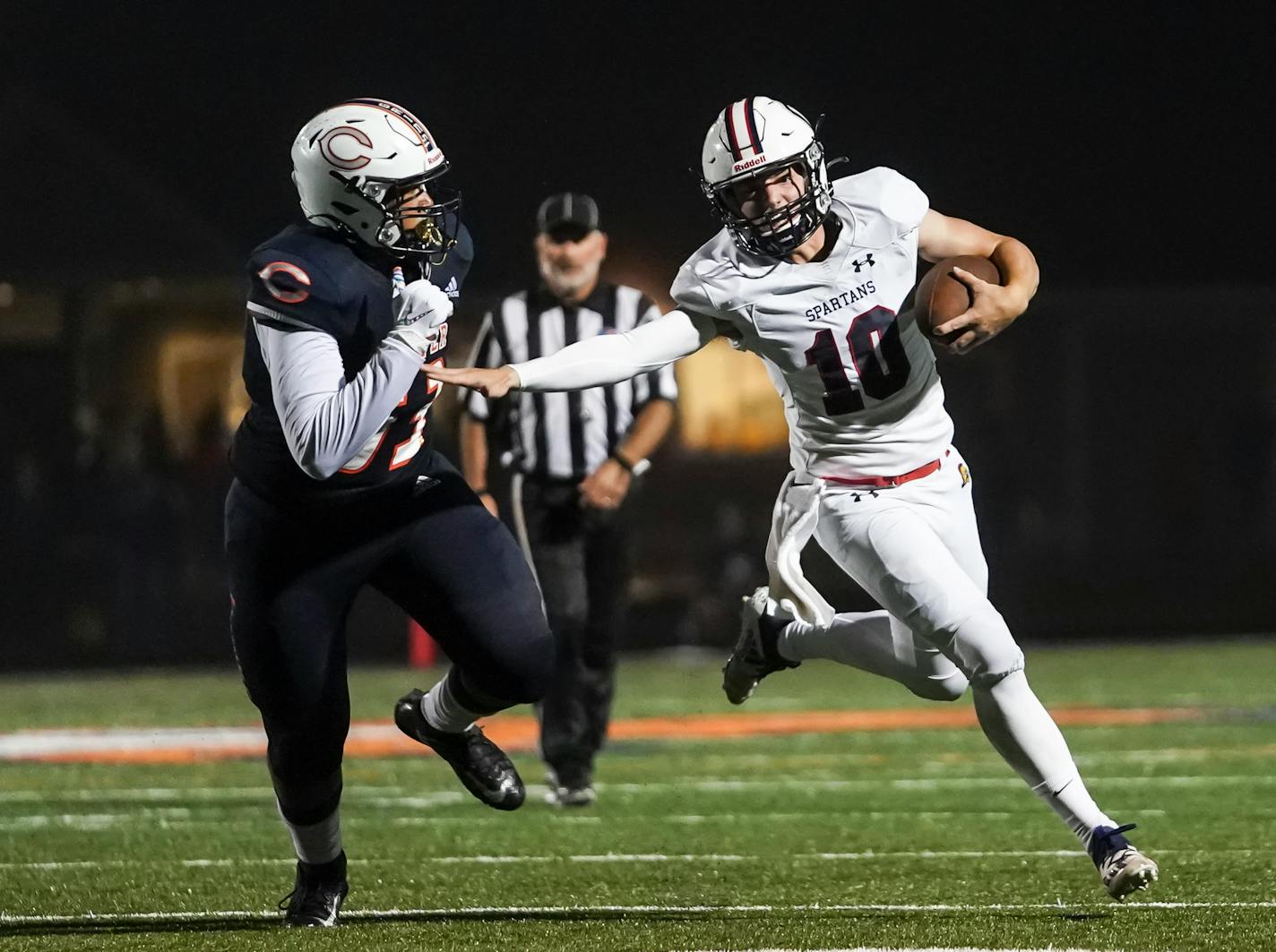 Orono High School Charlie Kraus (10) broke away from Cooper High School Deshawn Ricks (53) to run for a touchdown in the third quarter. Cooper defeated Orono, 43-27.