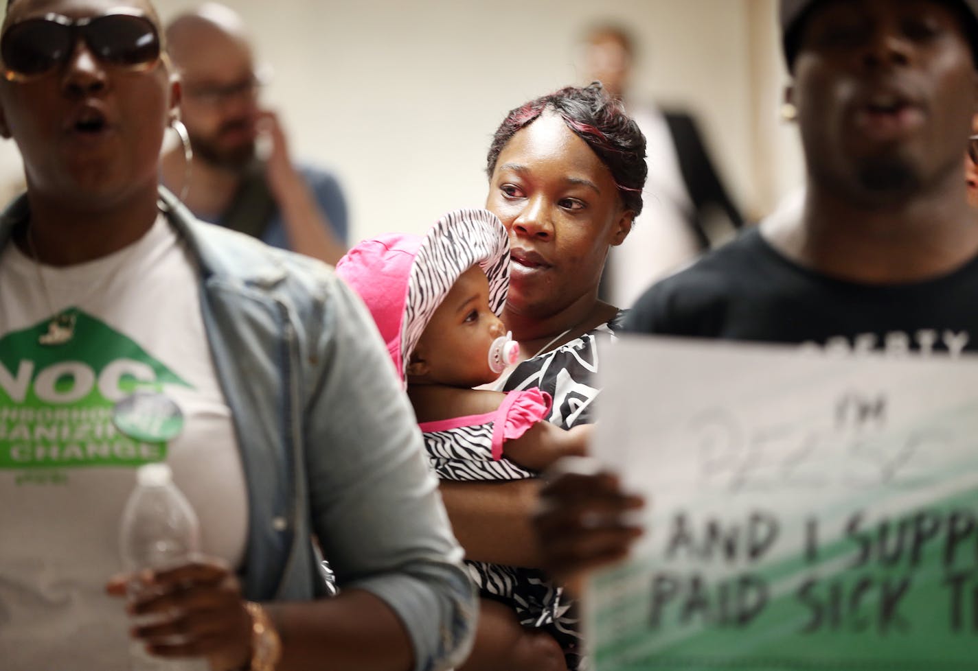 Devona Credit held her daughter Shyrya Credit 2, outside of the Minneapolis city council chambers Wednesday 18, 2016 in Minneapolis, MN.] Devona is a member of Neighborhoods organizing for change and the supports the sick-leave ordinance. Minneapolis City Council held a final public hearing on the proposed sick-leave ordinance at City Hall. Jerry Holt /Jerry.Holt@Startribune.com