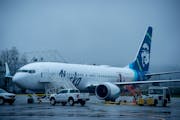 Alaska Airlines N704AL, a Boeing 737 Max 9 plane that lost part of its fuselage midair, parked at Portland International Airport on Jan. 8.