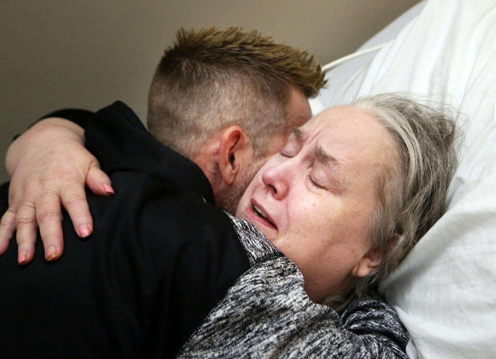 Suzanne Edwards hugged her son, Kent, at her senior care home. After Kent Edwards saw video of aides taunting and abusing his mother, he moved her to a new facility. One of the aides was eventually sentenced to 12 days in jail.
