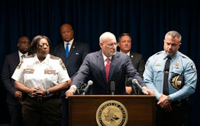 U.S. Attorney Andrew Luger announces charges against 14 Minneapolis gang members with possession of machine guns and fentanyl trafficking Wednesday at