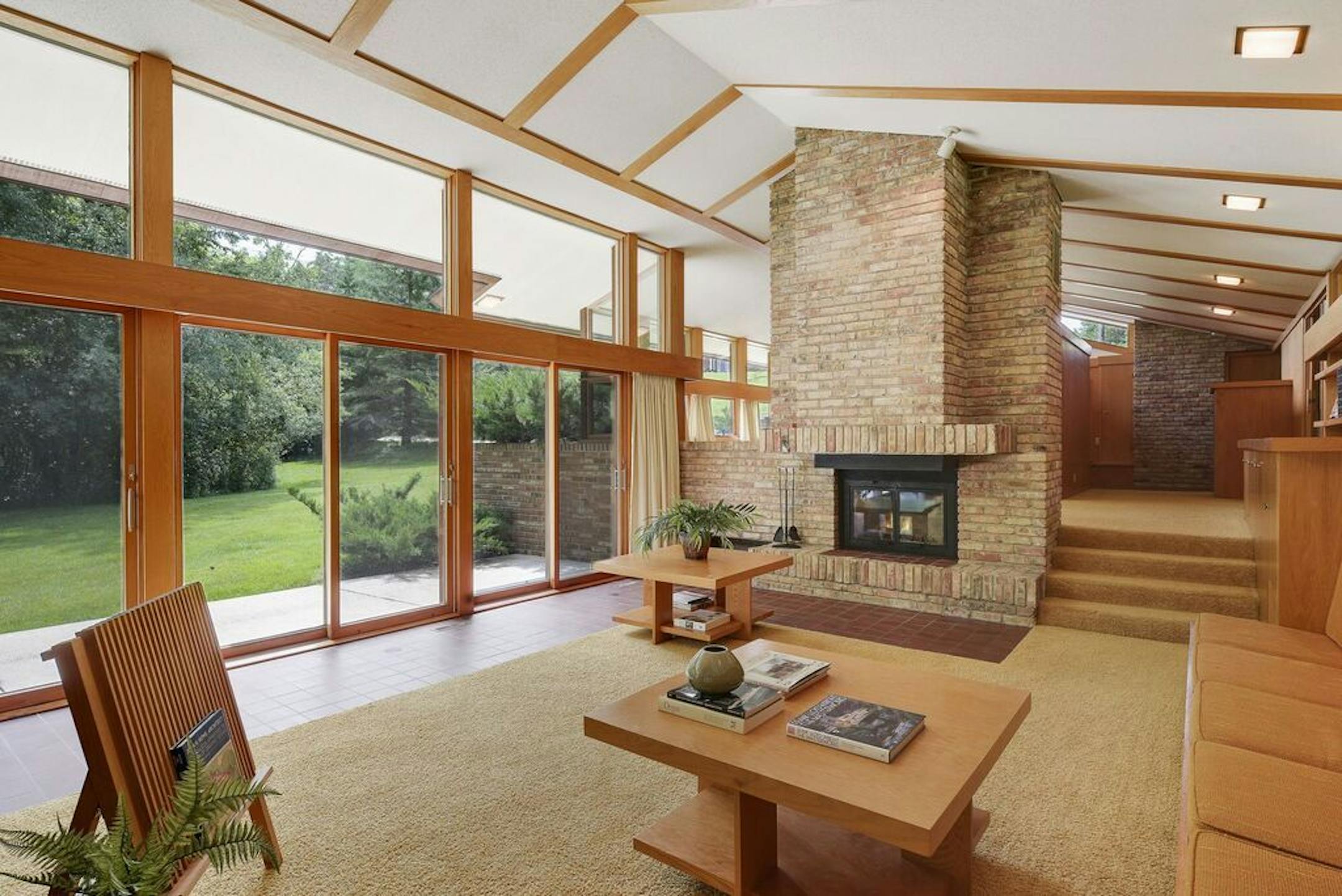There's a large central fireplace in the open floor plan.