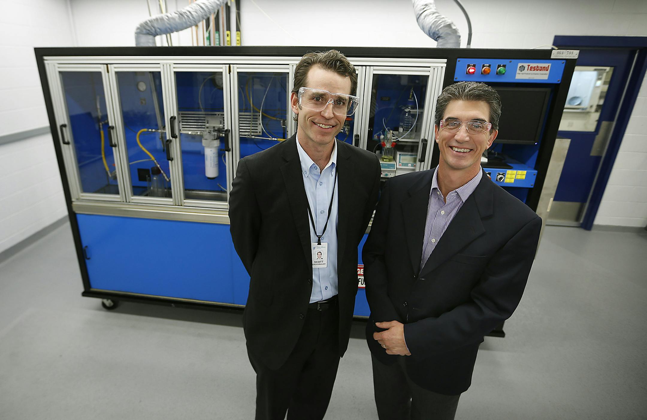 Scott Grossbauer, left, and Churck Christ of Donaldson Company, stood before one of their new filter system devices in one of their new labs, Wednesday, October 22, 104 in Bloomington, MN. ] (ELIZABETH FLORES/STAR TRIBUNE) ELIZABETH FLORES • eflores@startribune.com