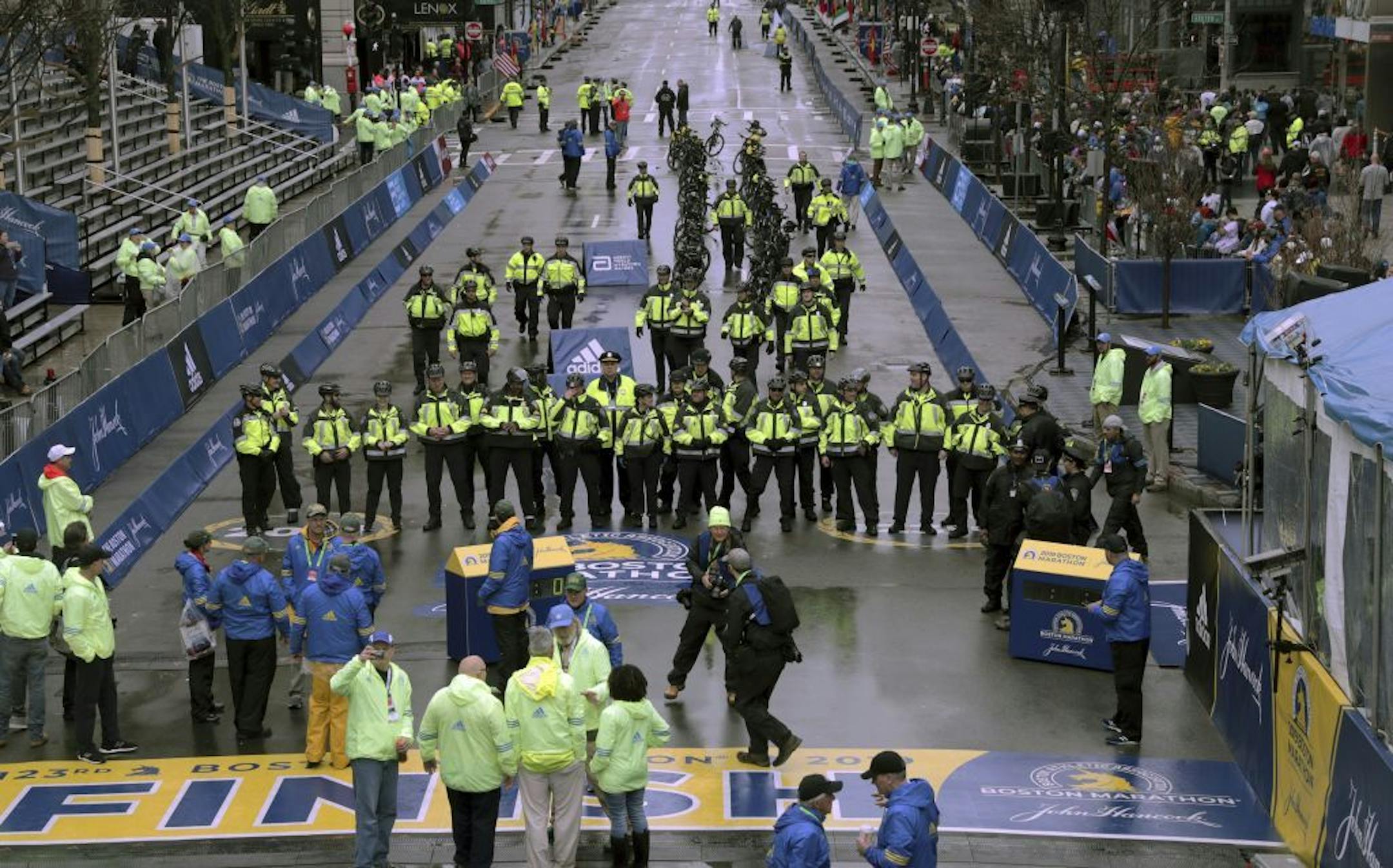 Police officers are shown at the finish line before the start of the 123rd Boston Marathon on Monday, April 15, 2019, in Boston.