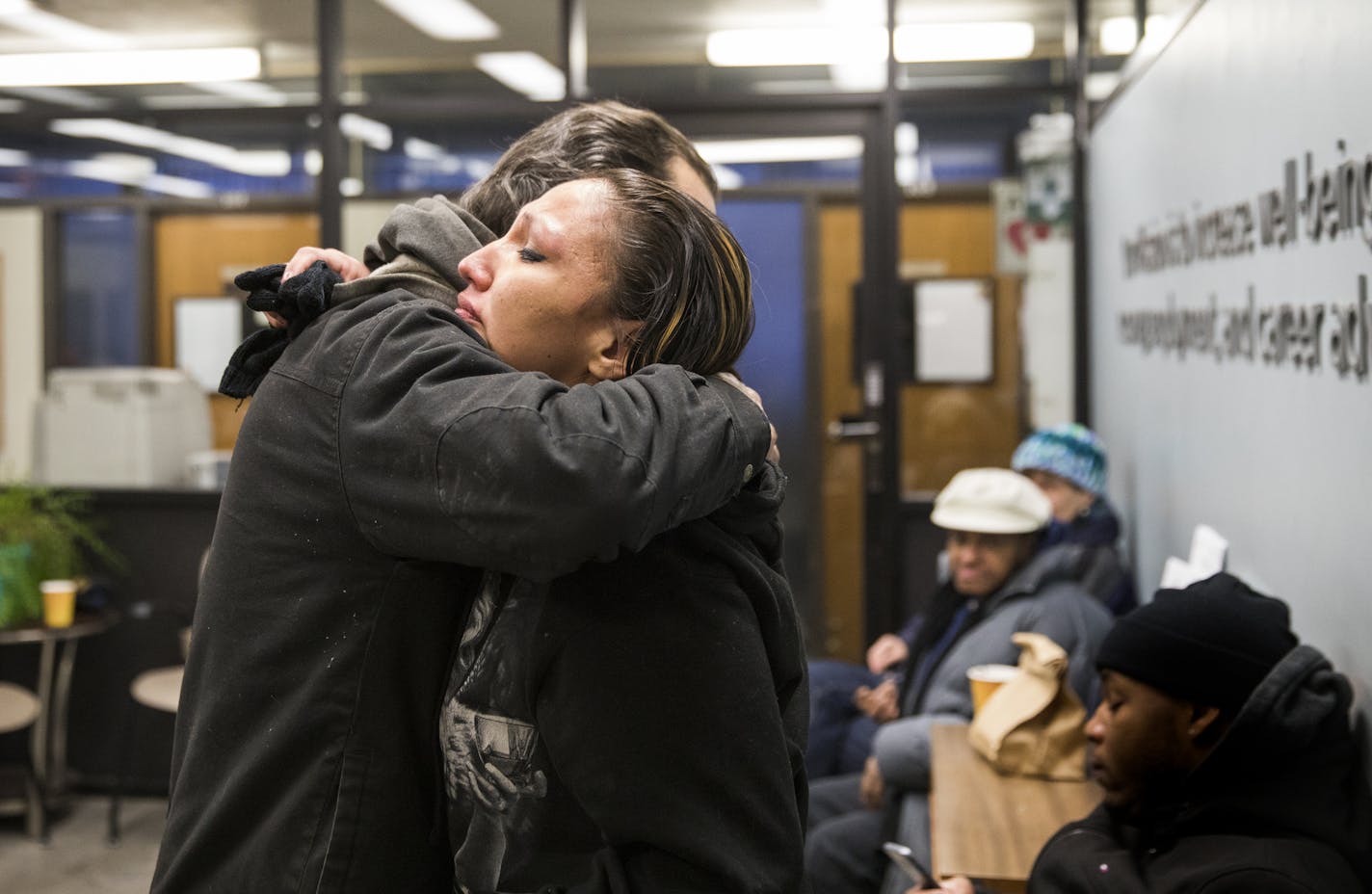 Angela Naviosh got a hug from Douglas Milek while they waited at the Avivo recovery center to take a chemical health assessment.