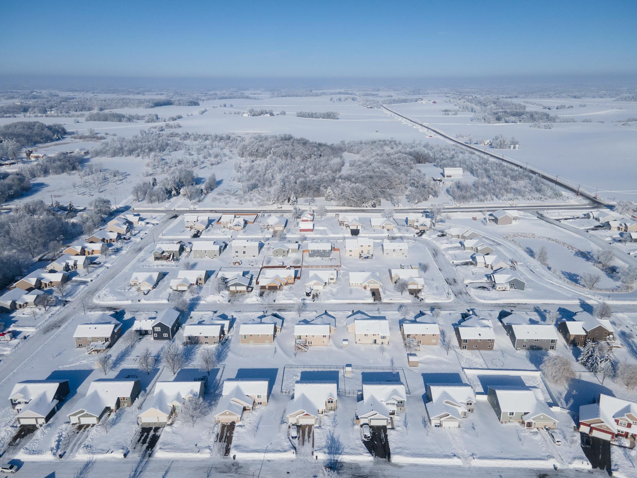 Lonsdale homes, built in the 2010s, sit on the edge of town, surrounded by rural land.