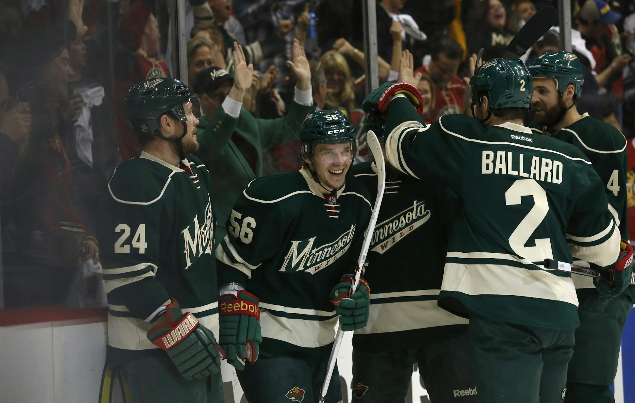 Minnesota Wild left wing Erik Haula (56) celebrated with fans and teammates after scoring to tie up the game during the second period.