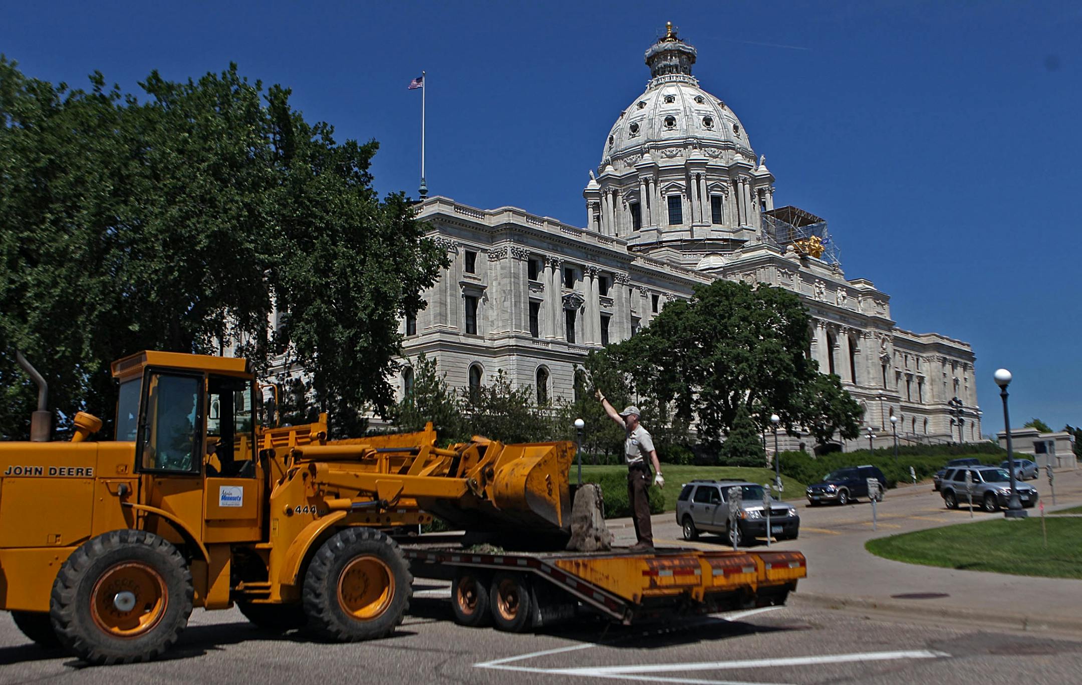 Workmen moved concrete barriers into place in various locations outside the Capitol Wednesday afternoon, June 29, 2011, as meetings continued inside the Governor's office in St. Paul, Minn., in hopes of avoiding a government shutdown.