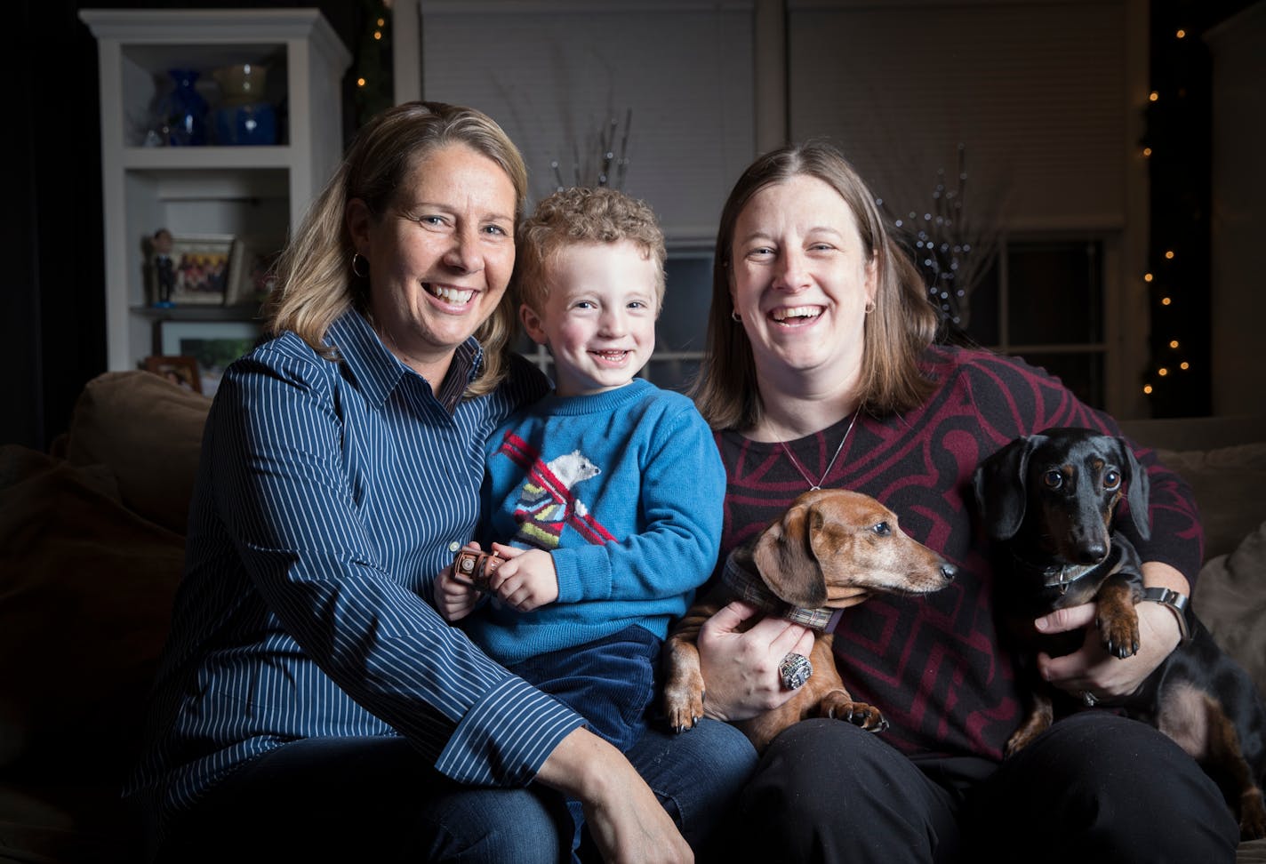 Four-time WNBA champion Lynx coach Cheryl Reeve, with son Oliver, spouse Carley Knox and their two dogs in their Minneapolis home, likes to describe herself as the mother of an extended family.