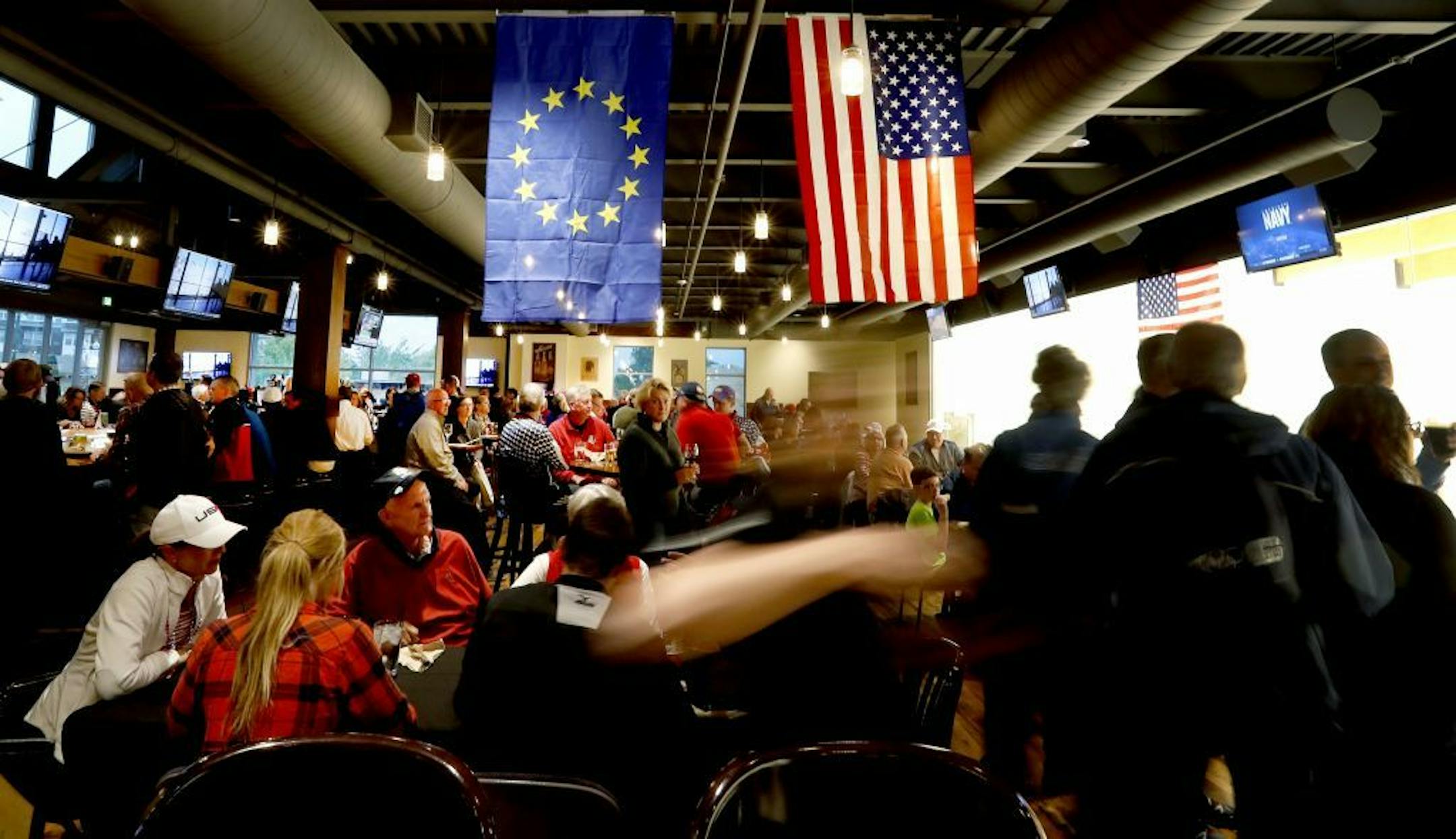 Team USA and Team Europe Ryder Cup flags hung at the Crooked Pint Ale House in Chaska. The city organized two promotional events to keep people in Chaska during the Ryder Cup this year.
