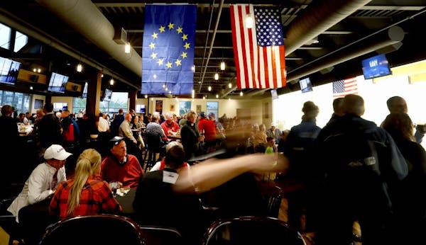 Team USA and Team Europe Ryder Cup flags hung at the Crooked Pint Ale House in Chaska. The city organized two promotional events to keep people in Cha