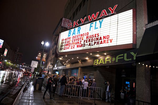 A crowd gathers outside BarFly and The Skyway Lounge Friday, Oct. 4, 2013 before Destroid performed. Photo by Leslie Plesser.