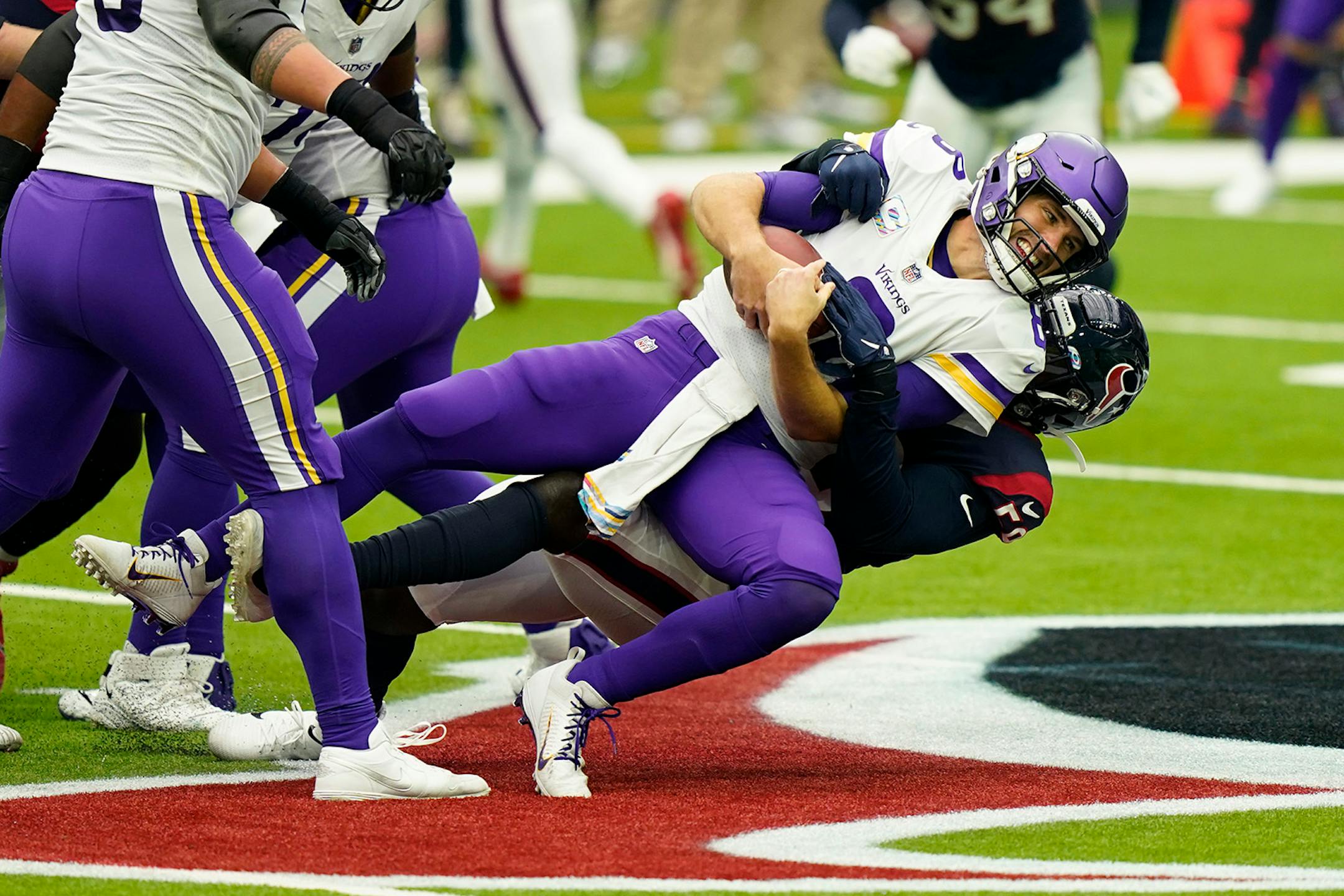 Minnesota Vikings quarterback Kirk Cousins (8) is sacked by Houston Texans outside linebacker Whitney Mercilus (59) during an NFL football game Sunday, Oct. 4, 2020, in Houston. (AP Photo/David J. Phillip)