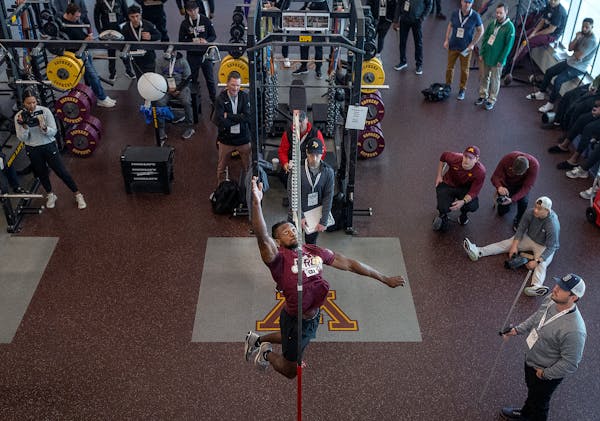 Minnesota's Justus Harris jumps the vertical jump during the Minnesota Pro Day in the indoor football facility at the Athletes Village in Minneapolis.