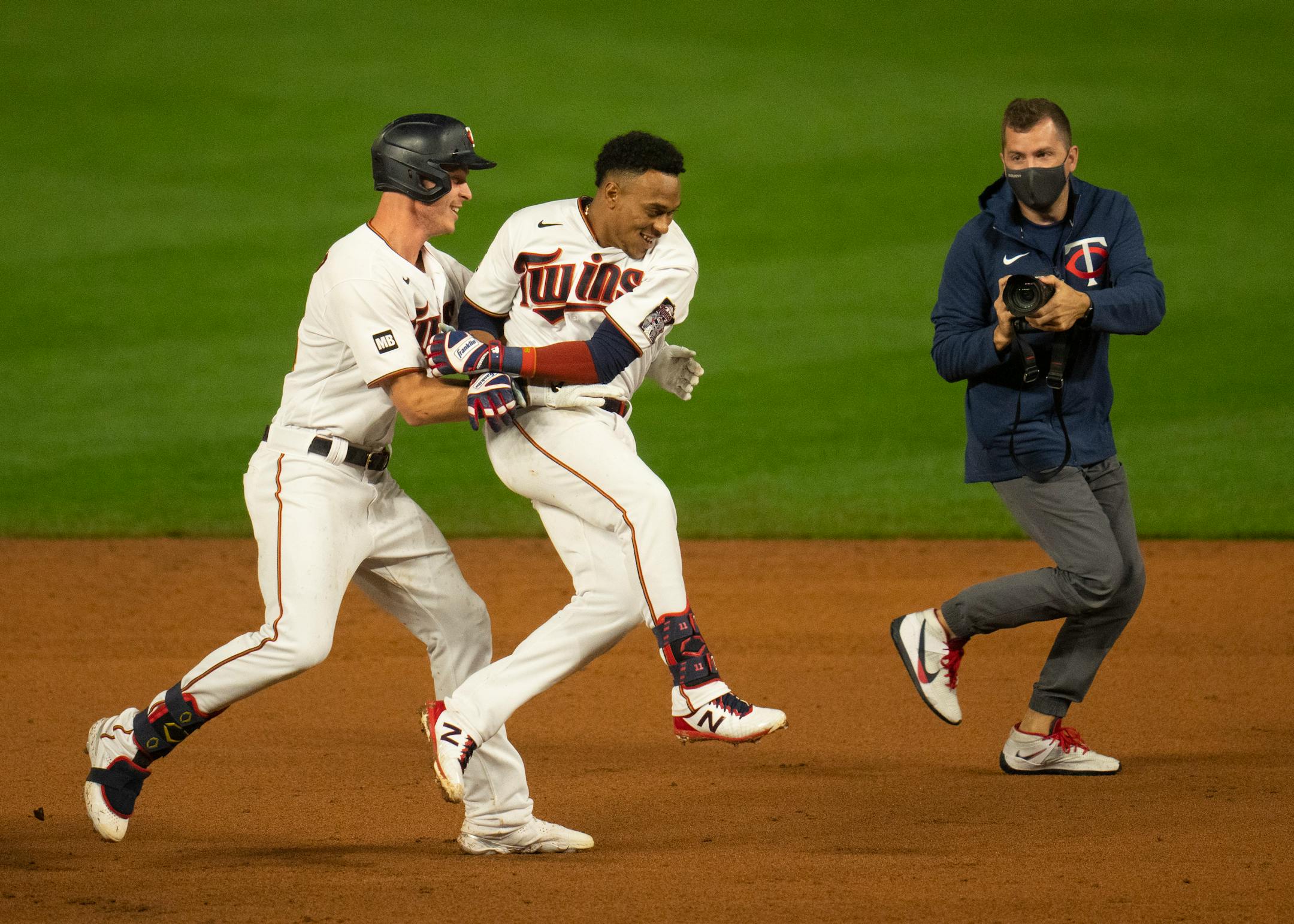 Minnesota Twins center fielder Max Kepler (26) chased down designated hitter Jorge Polanco (11) to celebrate after Polanco hit the ninth inning walk off single to give the Twins the win.