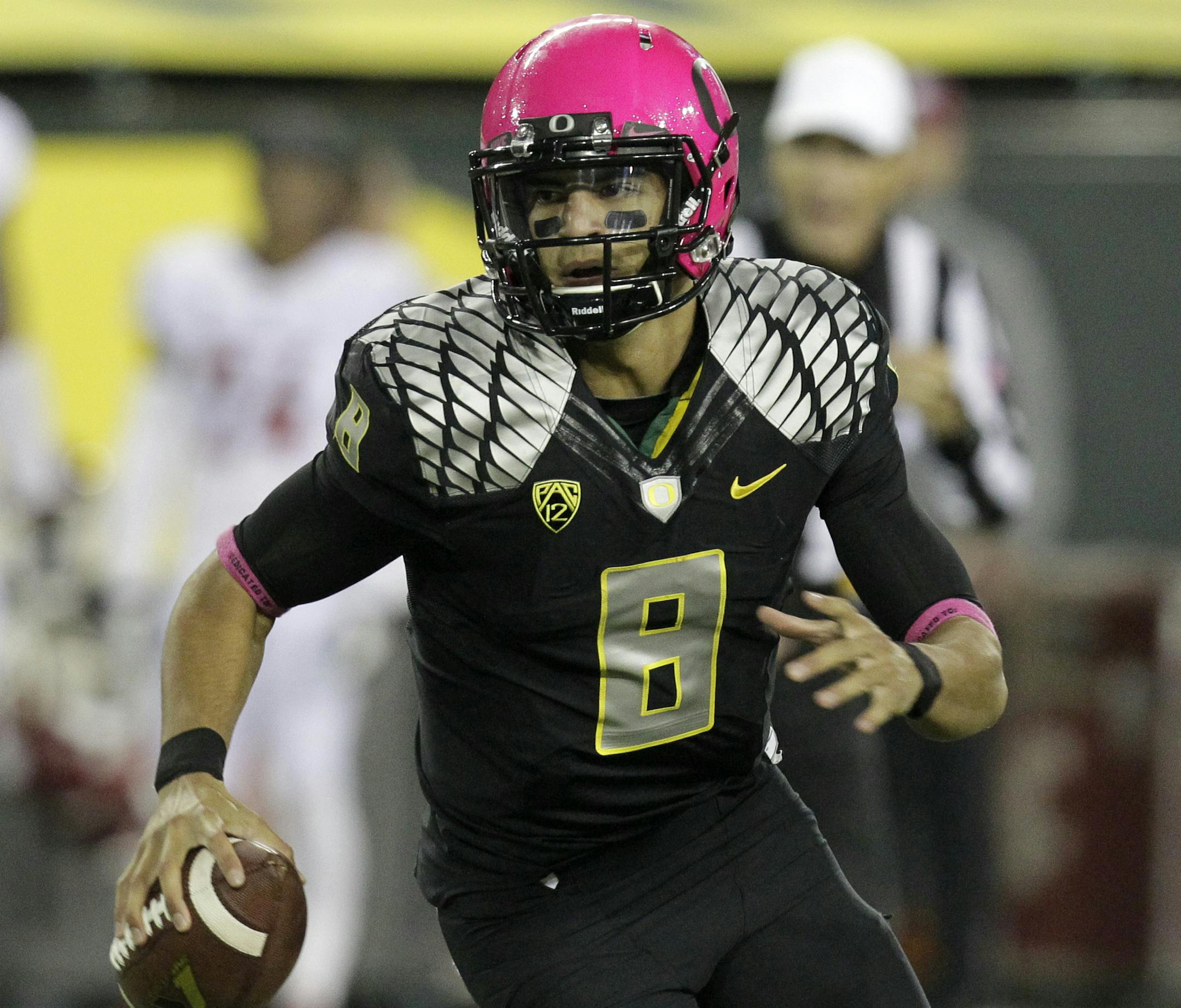 Oregon quarterback Marcus Mariota is shown during the second half of an NCAA college football game against Washington State in Eugene, Ore., Saturday, Oct. 19, 2013. (AP Photo/Don Ryan) ORG XMIT: MIN2013102417425875