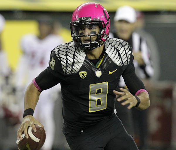 Oregon quarterback Marcus Mariota is shown during the second half of an NCAA college football game against Washington State in Eugene, Ore., Saturday,