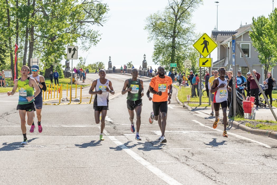Dominic Ondoro (in orange) has won the Twin Cities Marathon four previous times (2015-17, 2019).