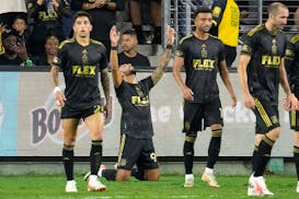 LAFC forward Denis Bouanga, second from left, celebrates his third goal during the first half Wednesday night in a 5-1 victory over visiting Minnesota