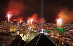 FILE - In this Jan. 1, 2015, file photo, fireworks explode above the Strip to ring in the new year in Las Vegas. County officials have signed off on a