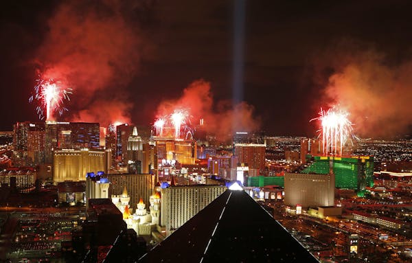 FILE - In this Jan. 1, 2015, file photo, fireworks explode above the Strip to ring in the new year in Las Vegas. County officials have signed off on a