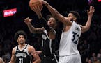 Nets guard D'Angelo Russell (1) was thought to be considering the possibility of joining his friend, center Karl-Anthony Towns (32), on the Wolves as 