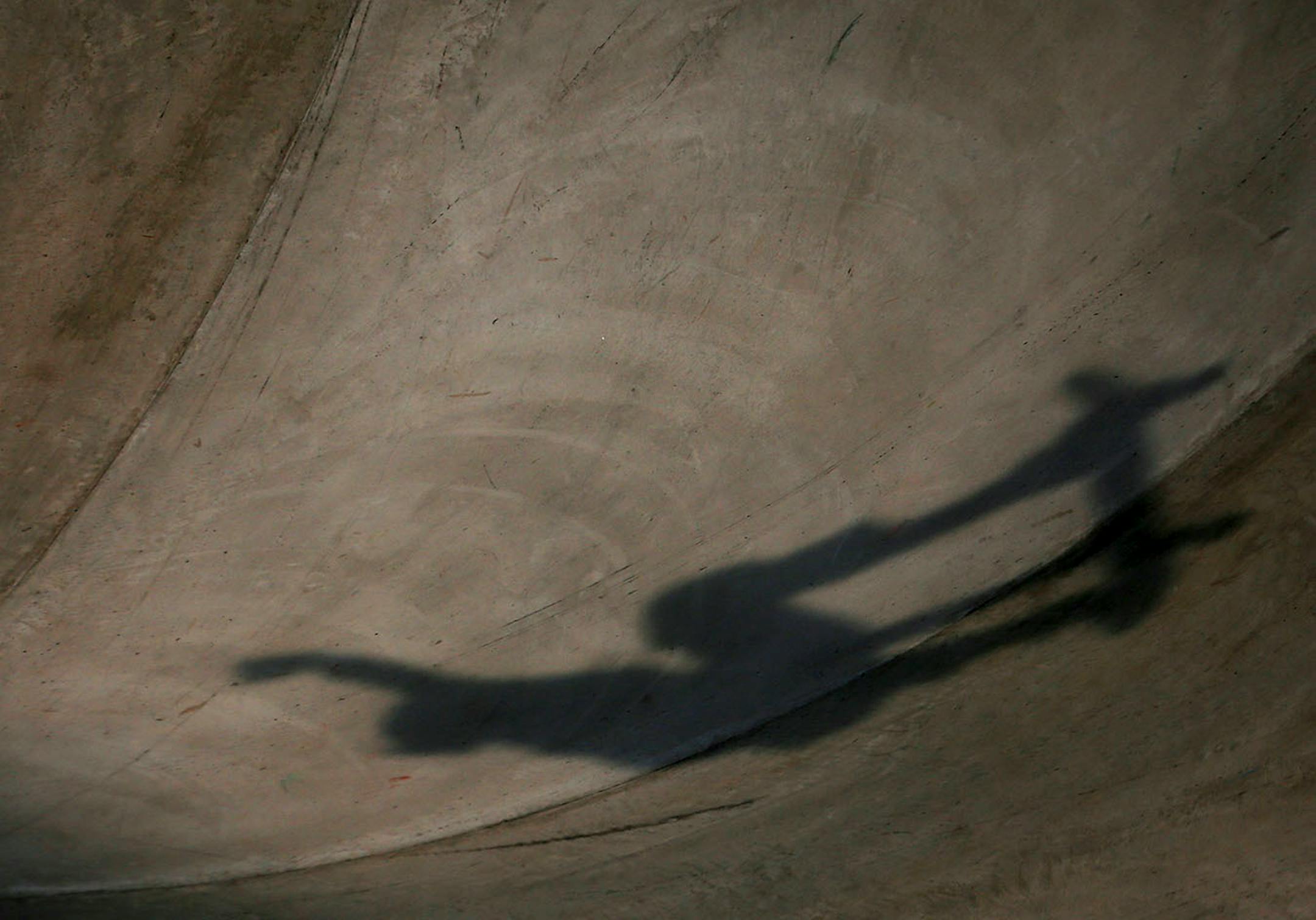 A skateboarder catches air in the women's skateboard park final.