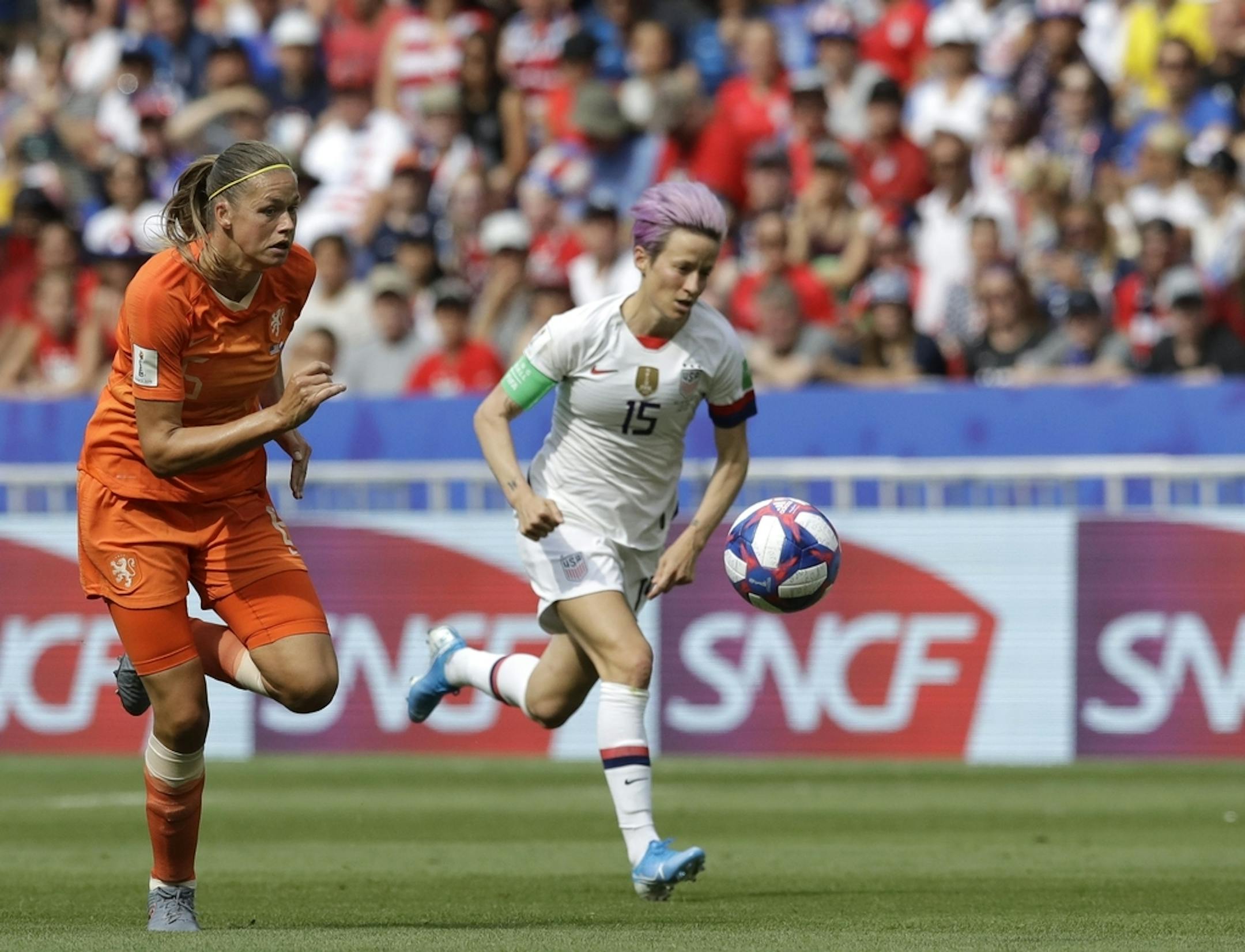 Netherlands' Anouk Dekker, left, challenges United States' Megan Rapinoe, right, during the Women's World Cup final soccer match between US and The Netherlands at the Stade de Lyon in Decines, outside Lyon, France, Sunday, July 7, 2019.