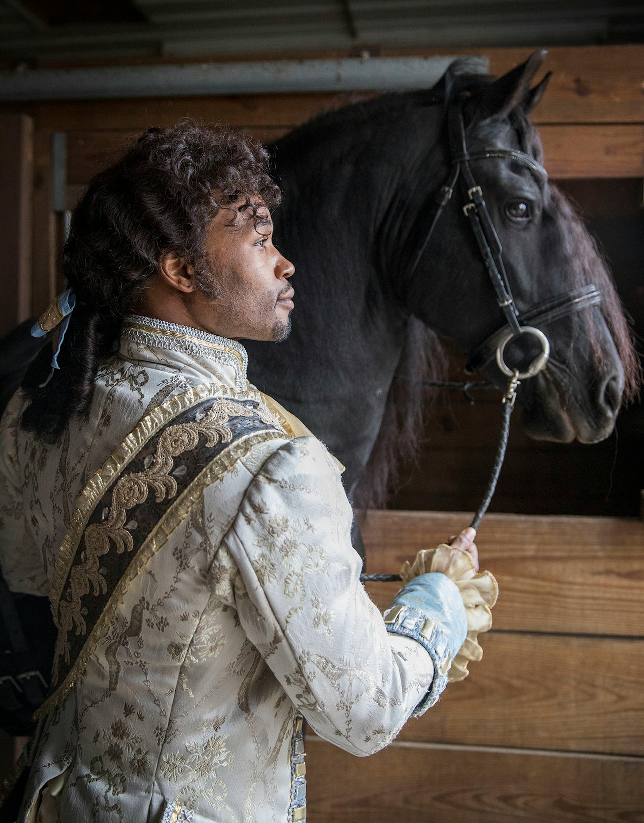 Actor David Murray from "Cinderella" posed with El Dante, a Friesian stallion.