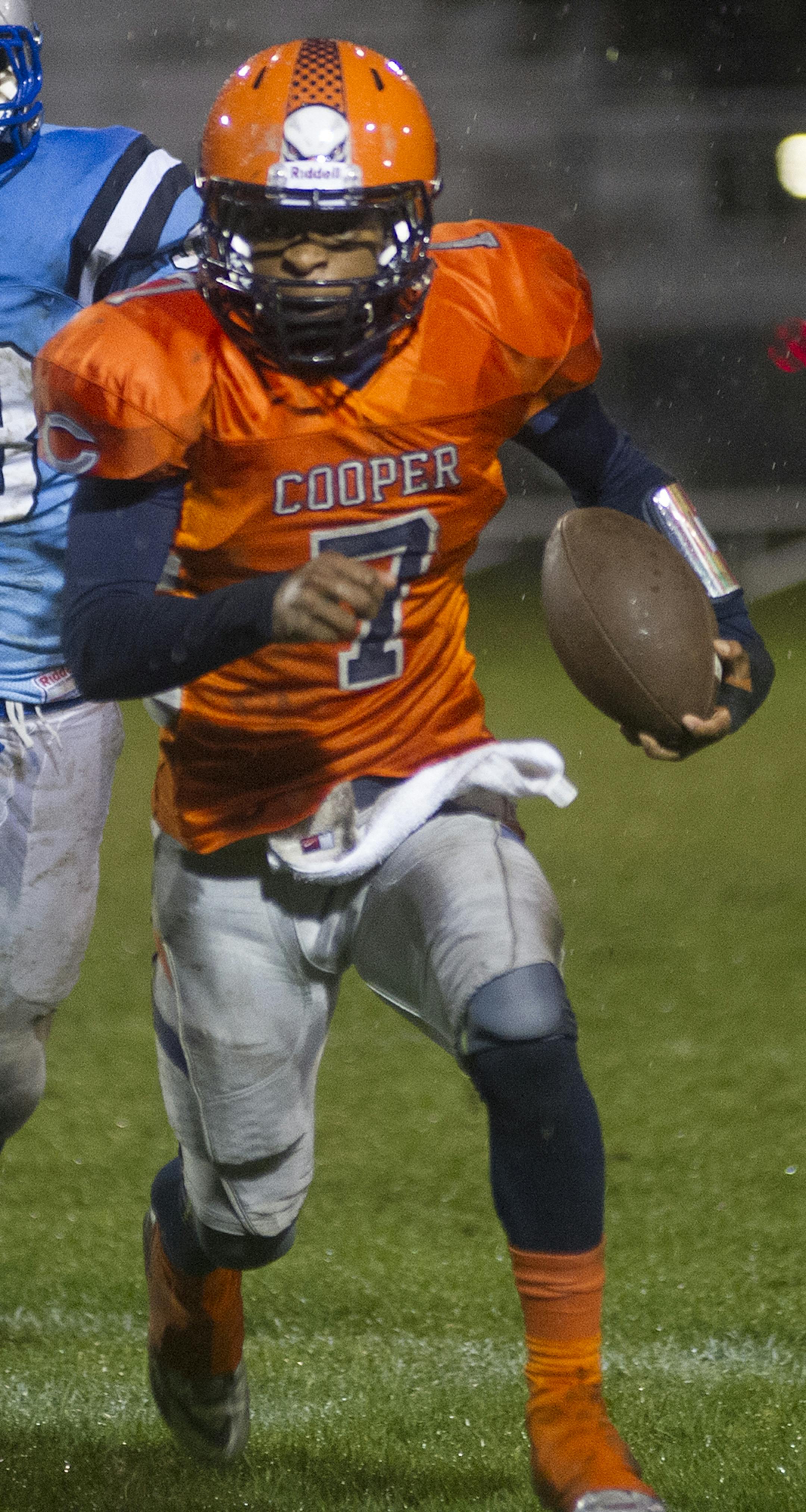 Cooper's Phillip Howard is pursued by Jefferson's Ted Kalina as he rushes around the outside during the first half of Friday night's game at Jefferson. ] (Matthew Hintz, 100214, Bloomington) ORG XMIT: MIN1410022023432386 ORG XMIT: MIN1509022137231742