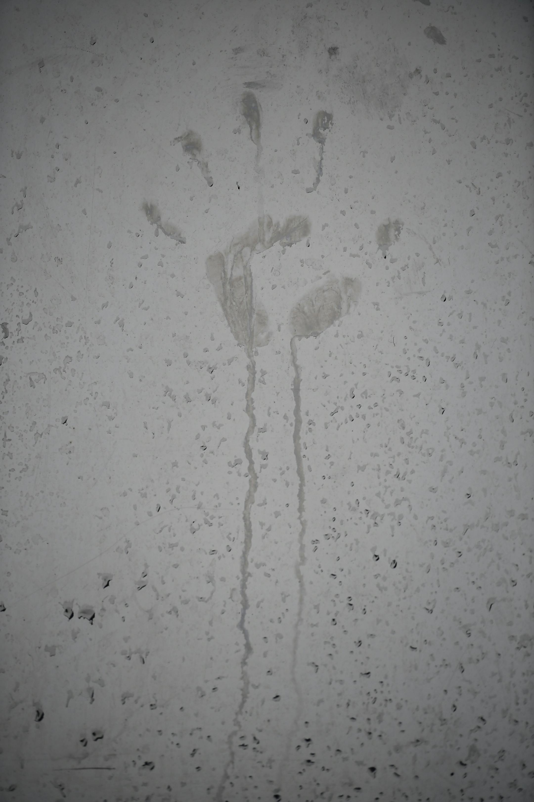 A dirty handprint was washed away by rain on Medtronic's "The Horn" sculpture Thursday.
