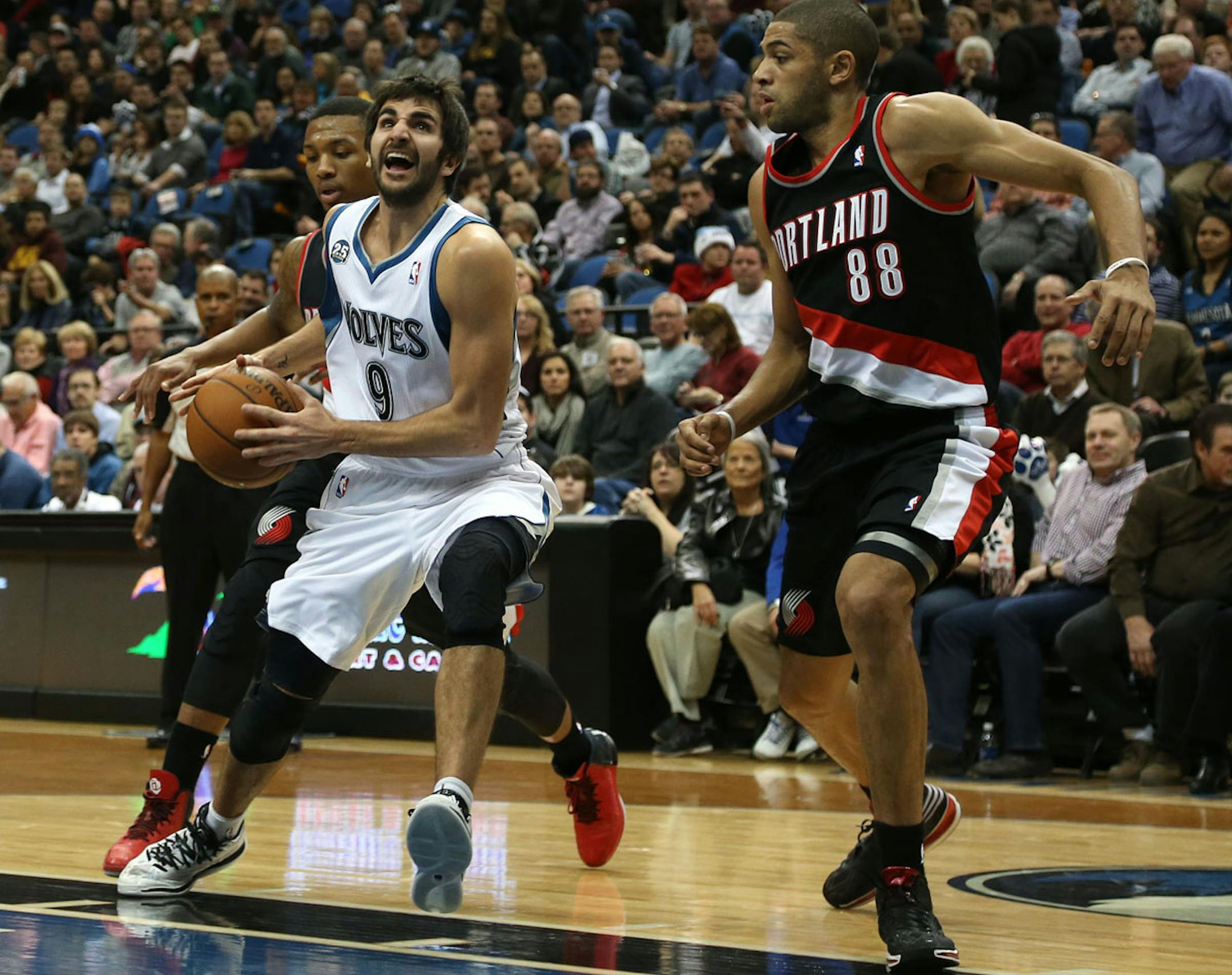 Wolves Ricky Rubio split the two Portland defenders and headed to the basket during the first half at the Target Center in Minneapolis Wednesday, December 18, 2013. ] (KYNDELL HARKNESS/STAR TRIBUNE) kyndell.harkness@startribune.com