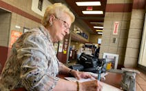 Karen Schaar, 76, of Bemidji, takes Mother's Day cards for her daughters to the Bemidji post office Wednesday. For years, she has paid extra for prior